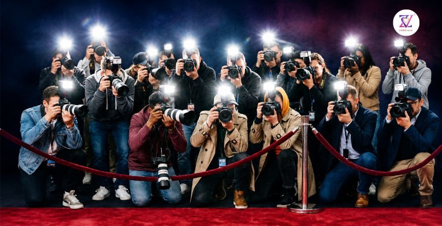 Paparazzi Red Carpet Fame Scene Paparazzi photographers crowd behind a velvet rope on a red carpet with bright camera flashes, symbolizing sudden fame and public attention
